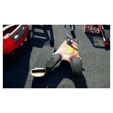 Two skate boards, one with steering handle both