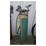 Older golf bag with assorted golf clubs. Wilson,