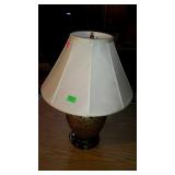Two ceramic table lamps with cloth shades,
