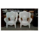 Two wicker patio chairs back leg that has been