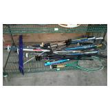 Bottom shelf - baseball bat, tri-pod, golf clubs,