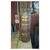 Vintage copper fire extinguisher with hose and