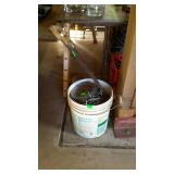 Bucket of nails and saw