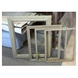 Group of four gilded style picture frames.