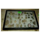 Show case of dug bullets and buttons