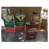 Box with sewing oil singer brand and one Necchi
