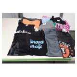 Various college football team t-shirts, range