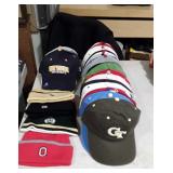 Various college sports hats and four beanies 34
