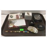 Tray lot with costume jewelry and belt buckles