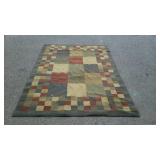 Wool area rug with square pattern 93 by 63 does