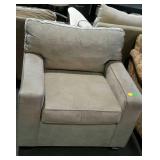 Upholstered living room chair. Grey toned.