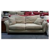 Thomasville two cushion tan sofa. Flared arms.