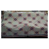 Older quilt. Red, white and blue. Well worn.