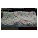 Tufted pinwheel quilt throw. Some wear damage.