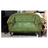 Parlor style love seat with green corduroy button