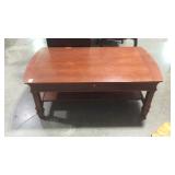Coffee table with pullout writing drawer some use