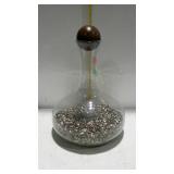 Chemist bottle with wooden ball stopper. Filled