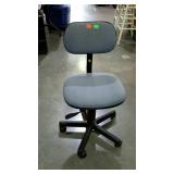 Light blue rolling, adjustable office chair.