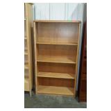 Oak finish bookcase. Adjustable shelves.