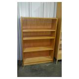 Oak finish bookcase. Adjustable shelving.