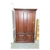 Dark stained entertainment armoire.  42"×23"×66".