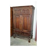 Large entertainment armoire on legs with carved