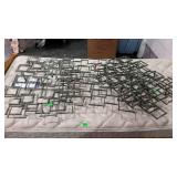 Three model home decor metal wall hangings.