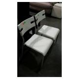 Two molded plastic chairs. Metal tube frames.