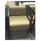 Accent chair with gold upholstery and dark finish