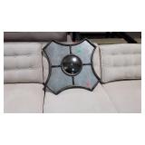 Wall decor, with small mirror in center matches