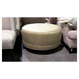 Large upholstered ottoman in a gold tone