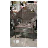 Faux wicker patio chair. Dark finish from our