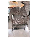 Faux wicker patio chair. Dark finish from our