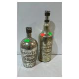 Pair of metallic painted wine bottles. From m