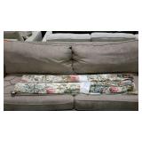Floral drapery panels, lined with pinched pleats,