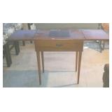 Sewing machine cabinet when closed 27 by 18 by 32