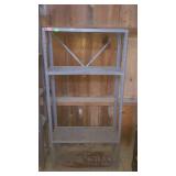 Metal 3-shelf shelving unit, one shelf is bent,