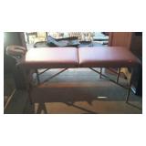 Folding massage table with adjustable height and