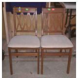 Two folding chairs, one does have damage on the
