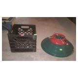 Christmas tree stand and empty milk crate