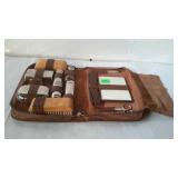 Older leather travel case with toiletries