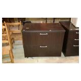 Two drawer lateral file cabinet. No key. Missing