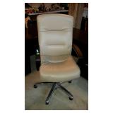 Tan, leather look office chair. One rub mark on