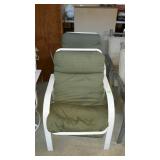 Two metal framed patio chairs with green