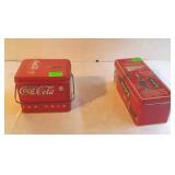 Two Coca-Cola tins
