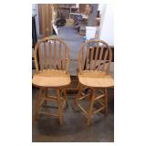 Two maple swivel bar stools 41 inches tall and