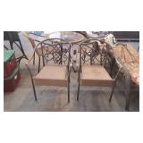 Two patio chairs, wicker seating metal leg frame