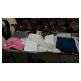 Table lot with linens, sheets, fabrics, blanket