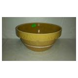 Early pottery mixing bowl with reddish white