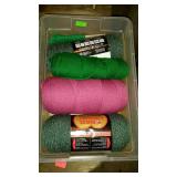 Plastic container with yarn